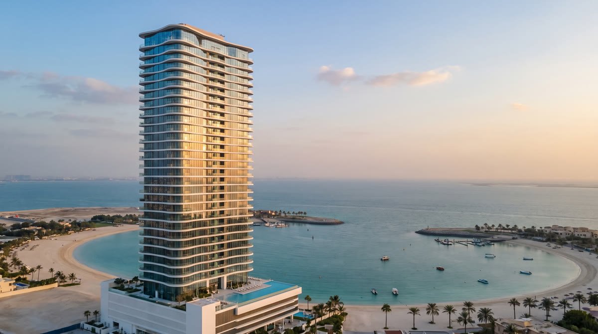 Coastline template preview: a slender glass tower beside a turquoise bay